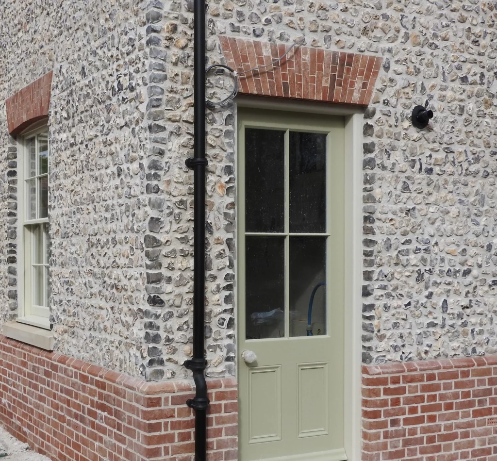 Listed building pointing Kent - heritage flint and brick restoration with lime mortar
