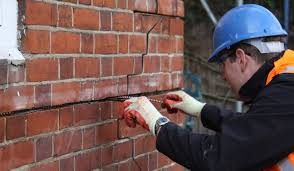 Brick repair specialists Kent - expert craftsman performing brick replacement and repairs