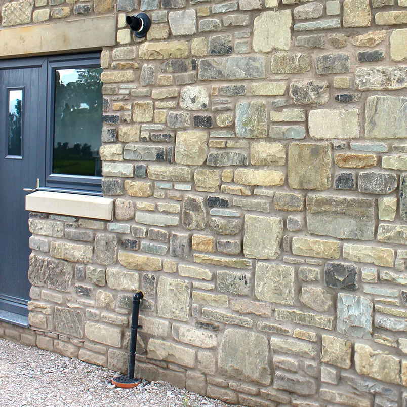Heritage stone walling Kent - mixed reclaimed stone pointing craftsmanship